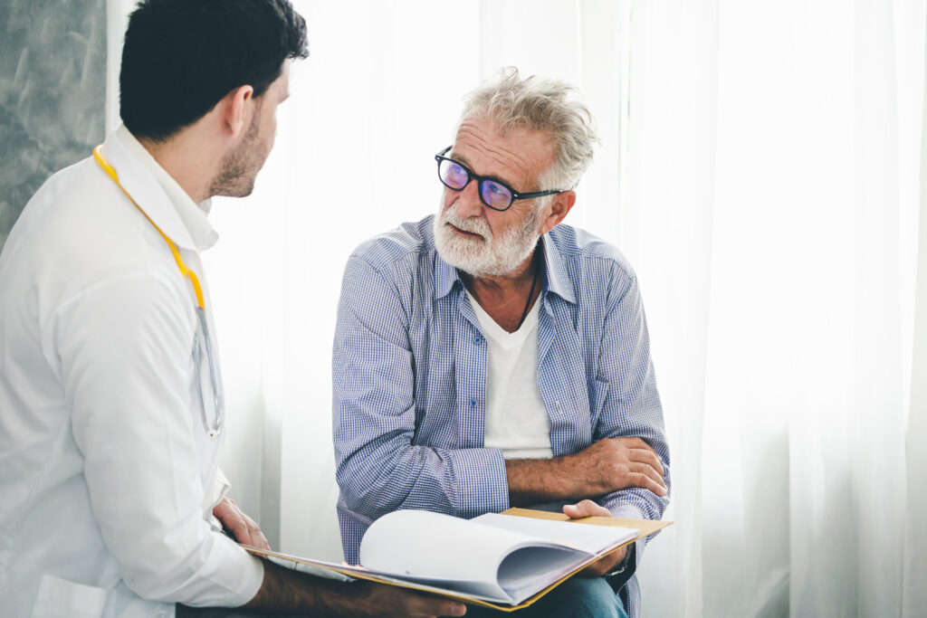 Older Man Meeting with Doctor