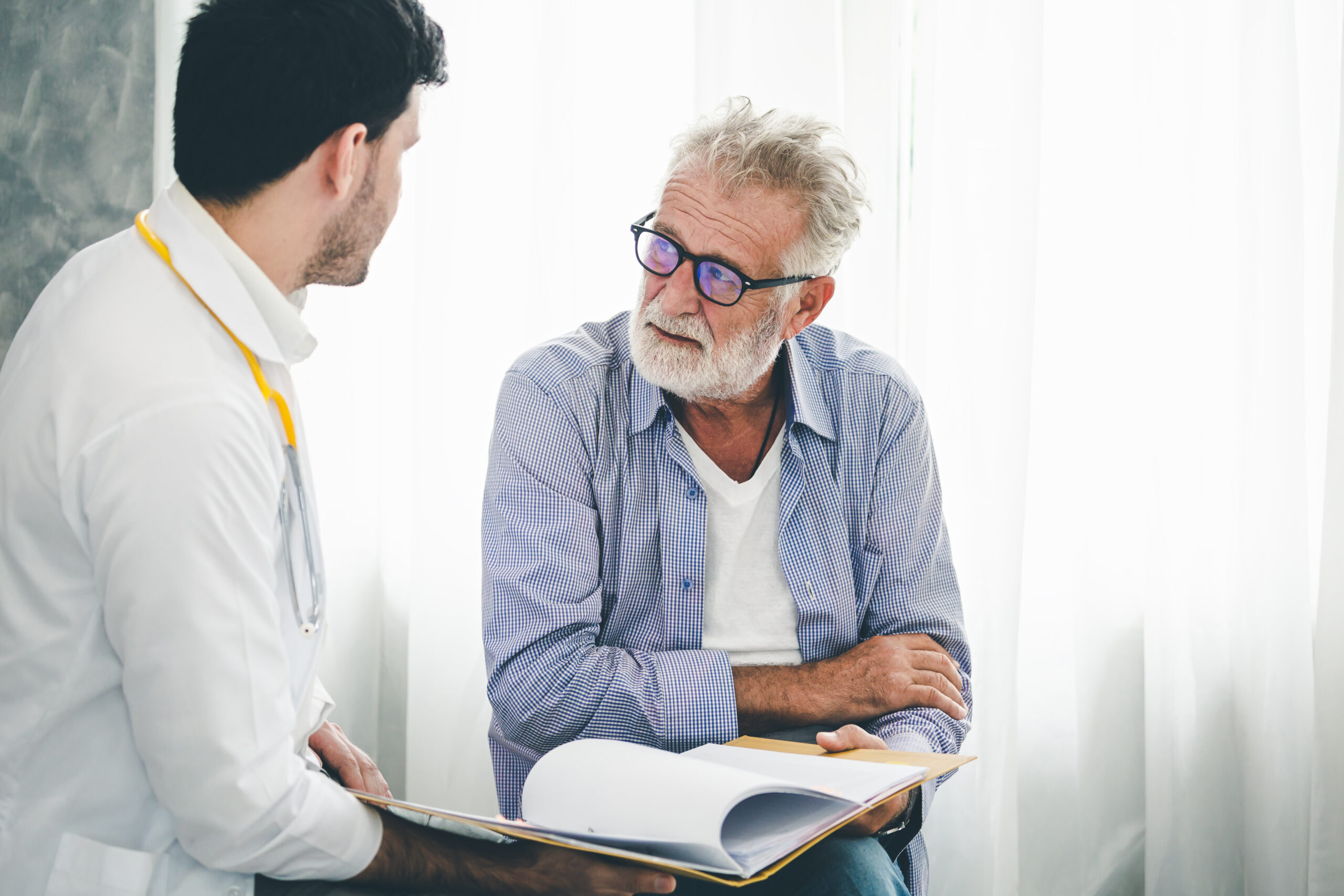 Older Man Meeting with Doctor scaled