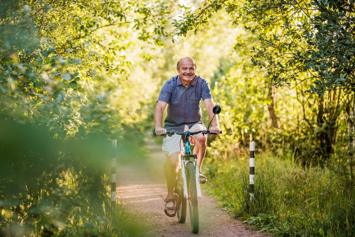 Older Man Riding Bicycle